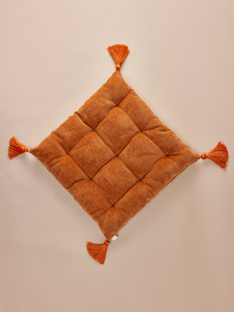 Square velvet pillow with decorative tassels