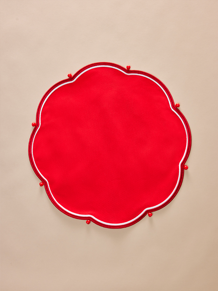 Round red napkin with embroidery