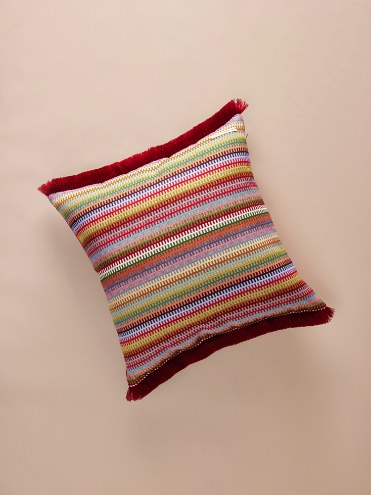 Velvet patterned pillowcase with small fringe.