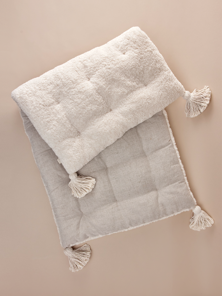 Bench cushion with decorative tassels