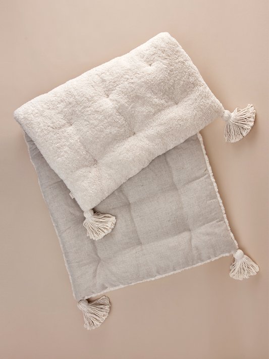 Bench cushion with decorative tassels