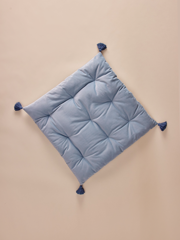 Square velvet pillow with decorative tassels
