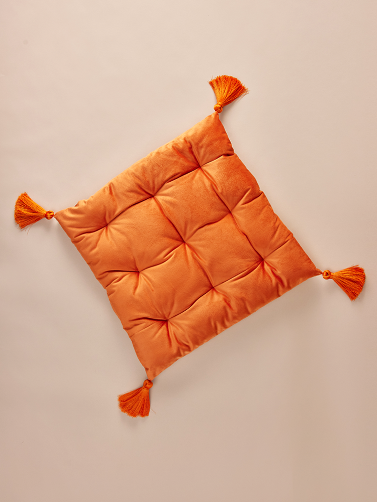 Square velvet pillow with decorative tassels