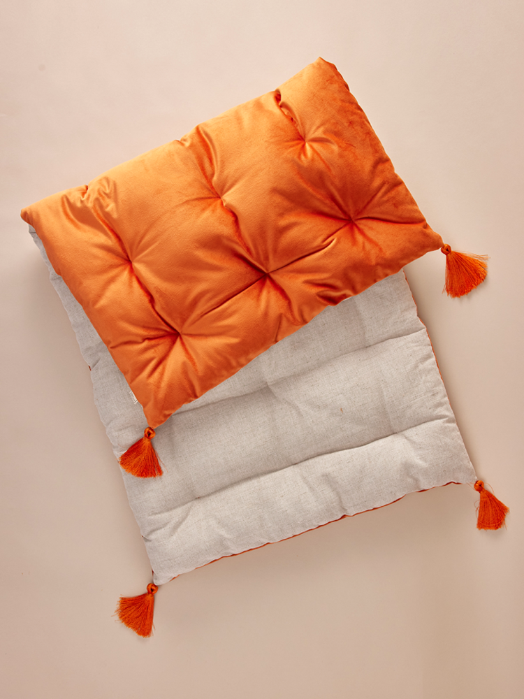 Bench cushion with decorative tassels