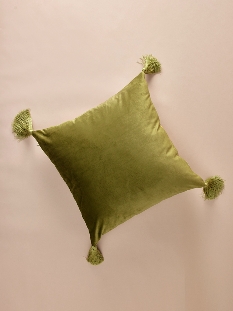 Velvet pillowcase with geometric pattern and decorative tassels.