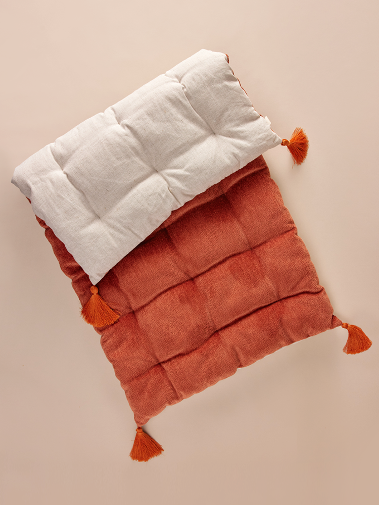 Bench cushion with decorative tassels