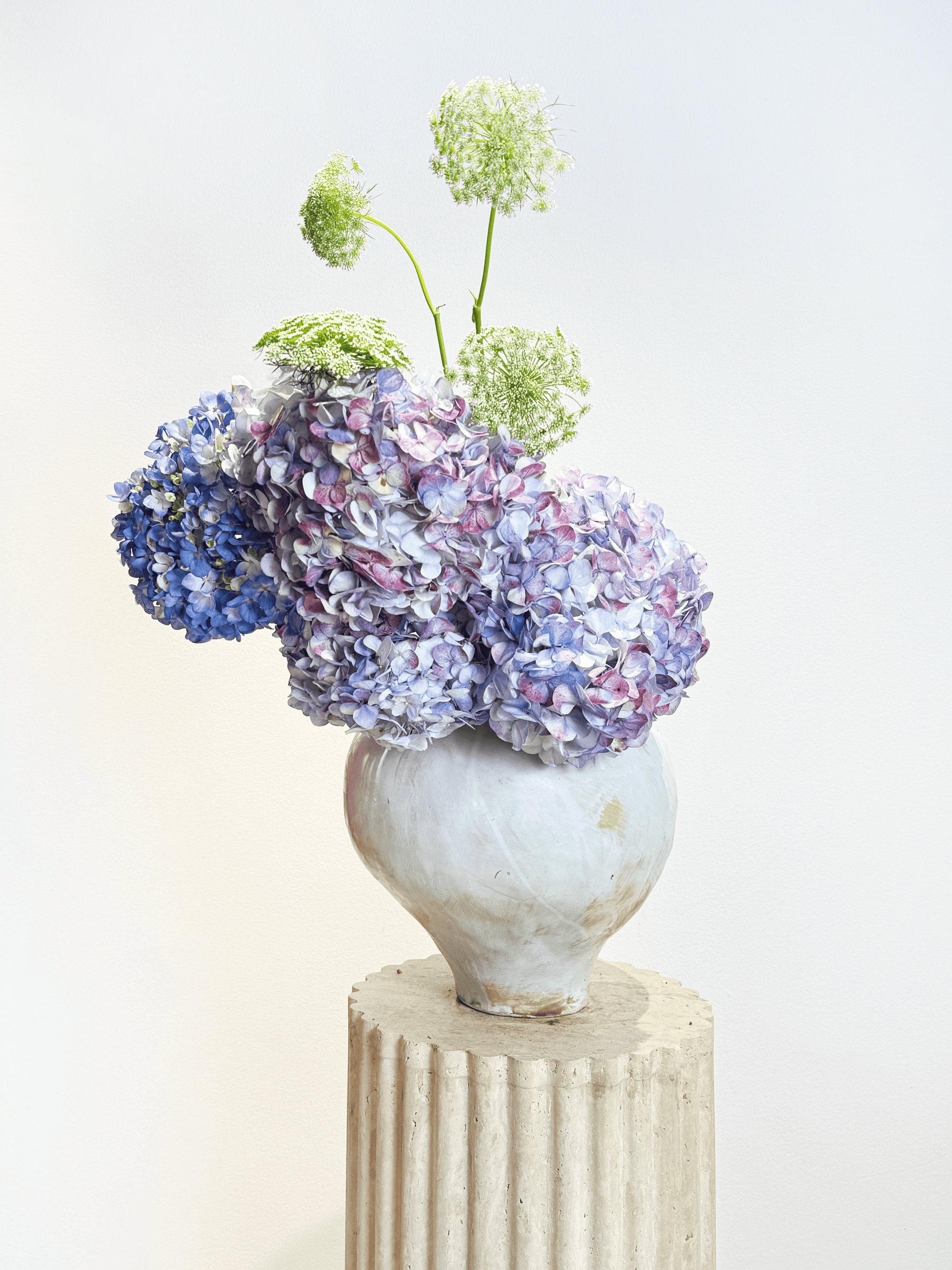 Flower delivery in Dubai: The color of calm arrangement in an elegant vase