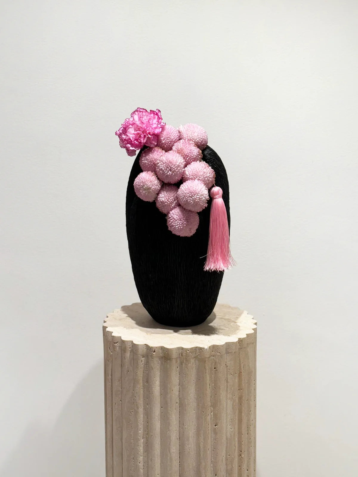 Flower delivery in Dubai: The unique whimsical wonder arrangement in a sleek, dark vessel